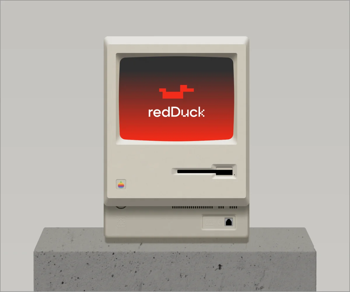 Retro RedDuck computer on a concrete pedestal